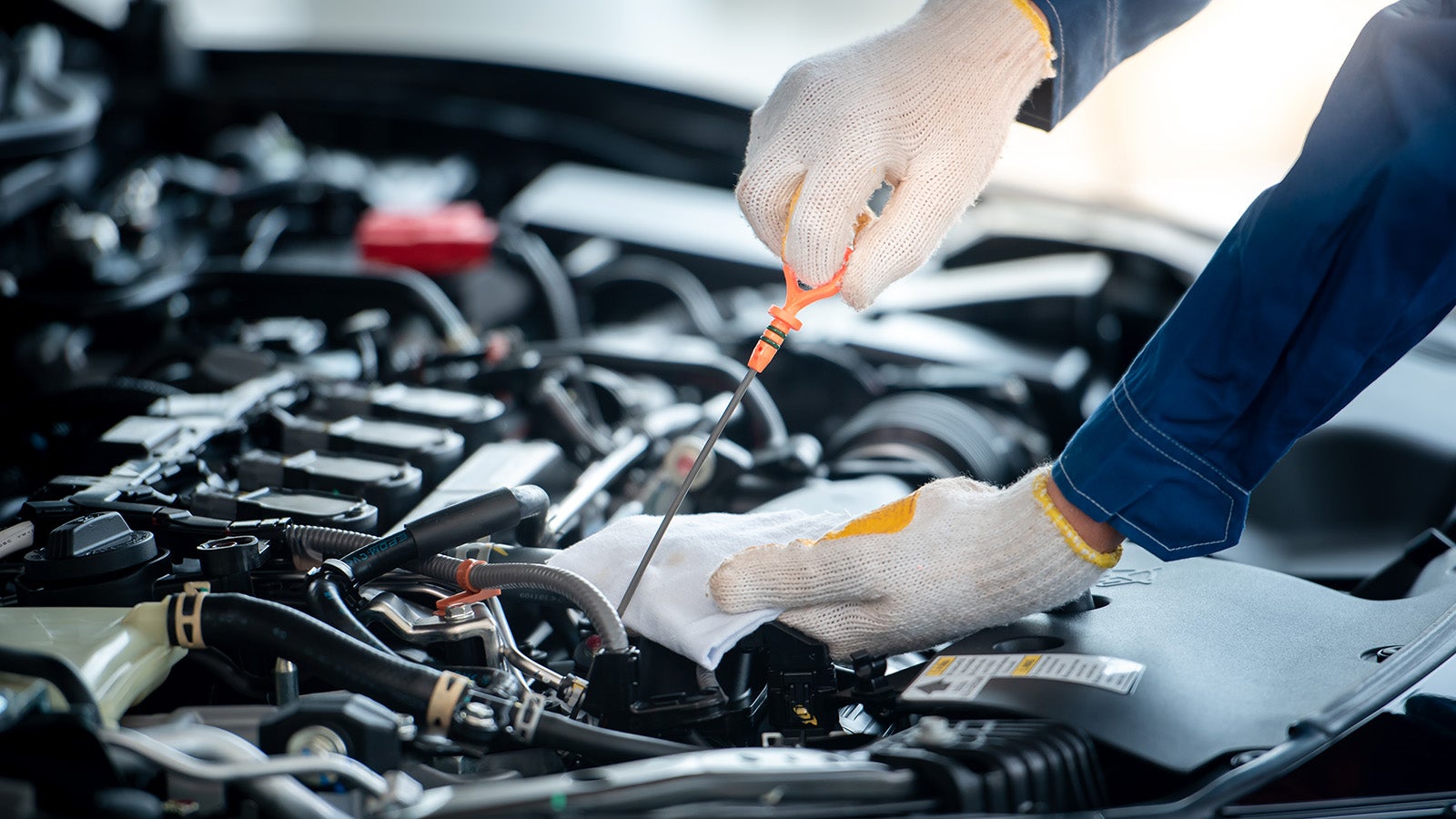 Service tech changing oil